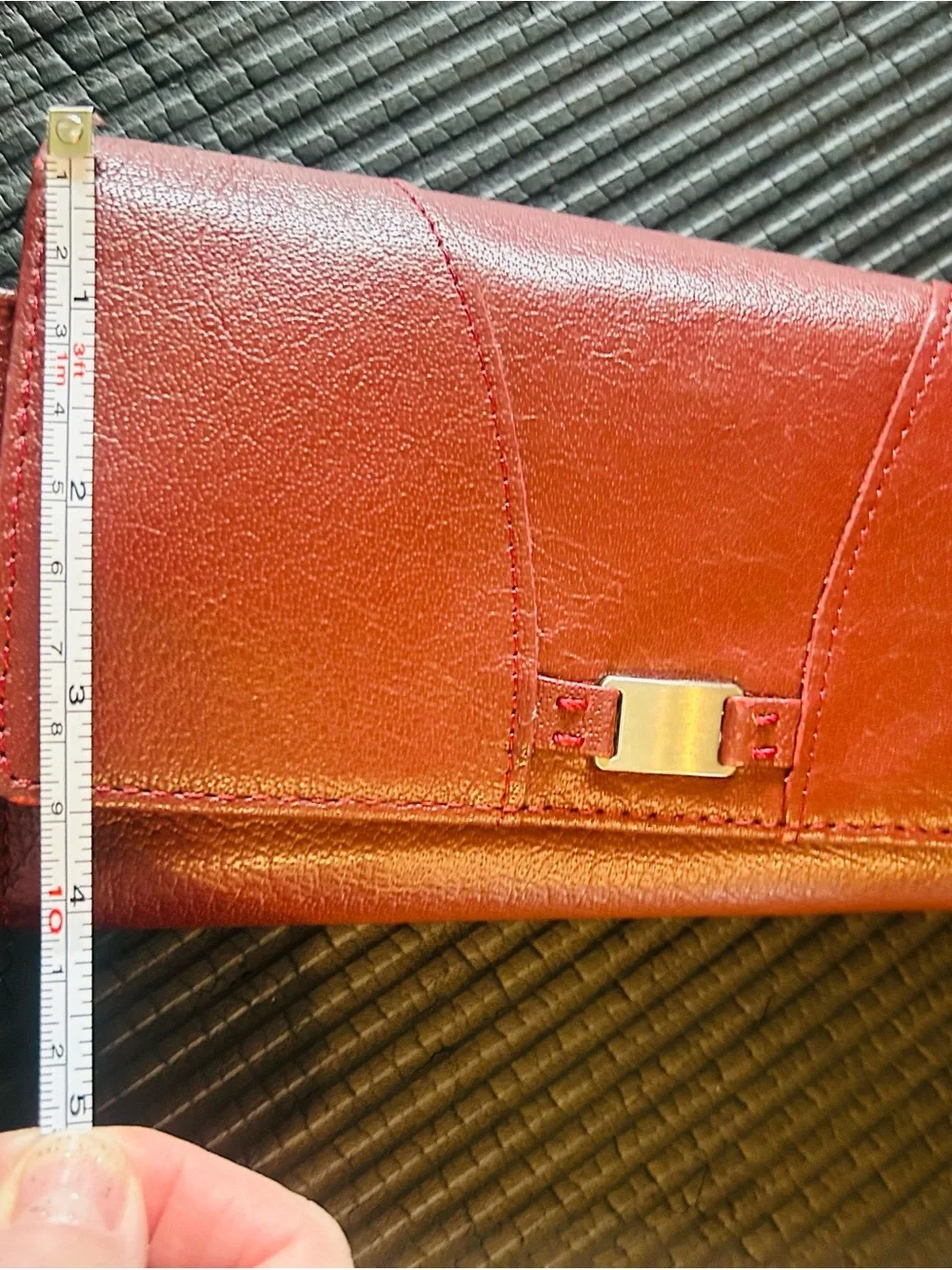 Wilson’s leather, maroon Leather trifold, wallet with Gold Accent